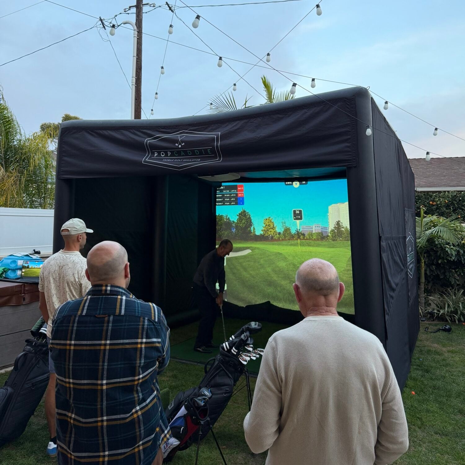 PopCaddie mobile golf simulator rental setup at a private party in Manhattan Beach California