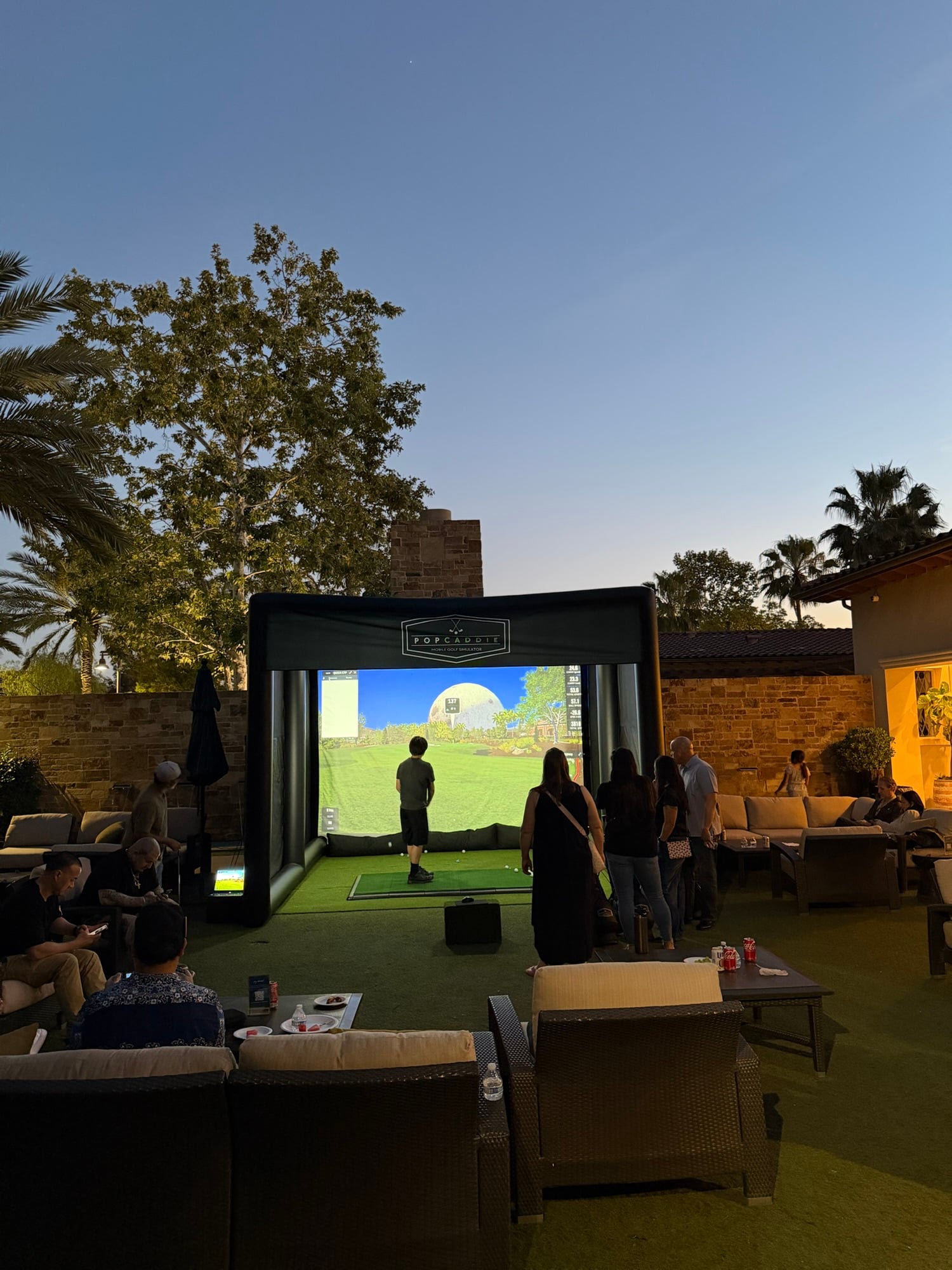 PopCaddie mobile golf simulator outdoor event setup Huntington Beach California